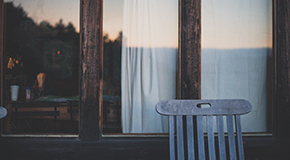 Blue Chair in Front of Window