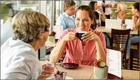 Mom and daughter having coffee