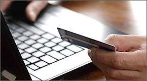 Man at laptop with credit card