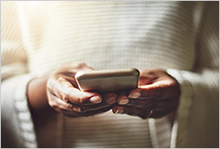 Woman's hands on a cell phone